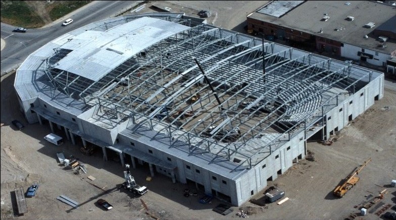 Roof membrane being installed